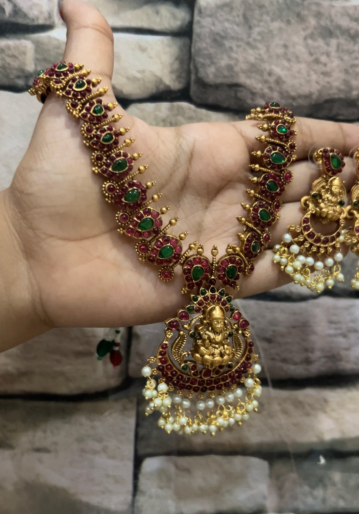 Red with green stone Lakshmi Devi set