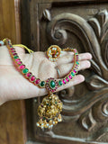 Red  with green stone adigai
