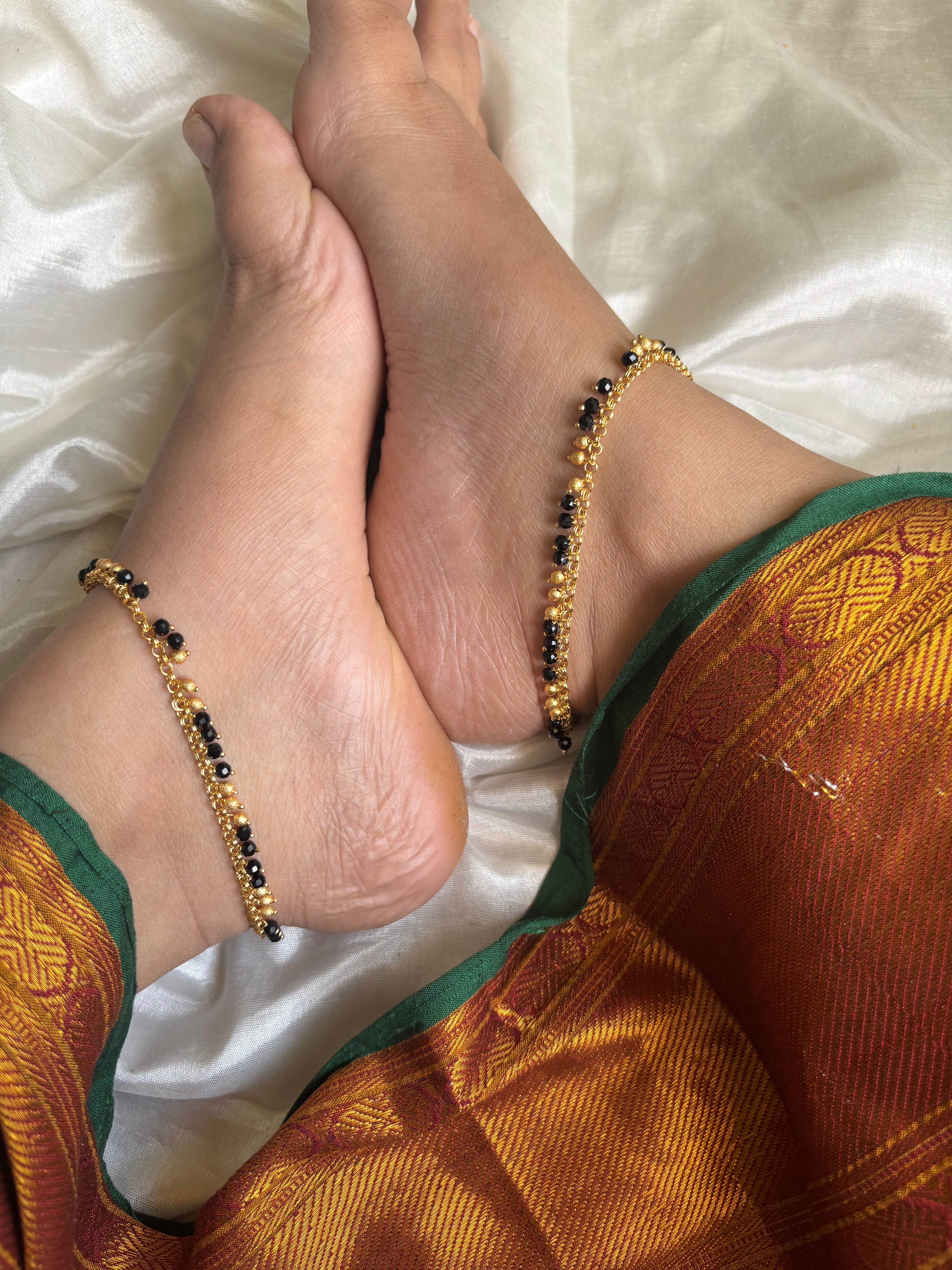 Black and gold anklets
