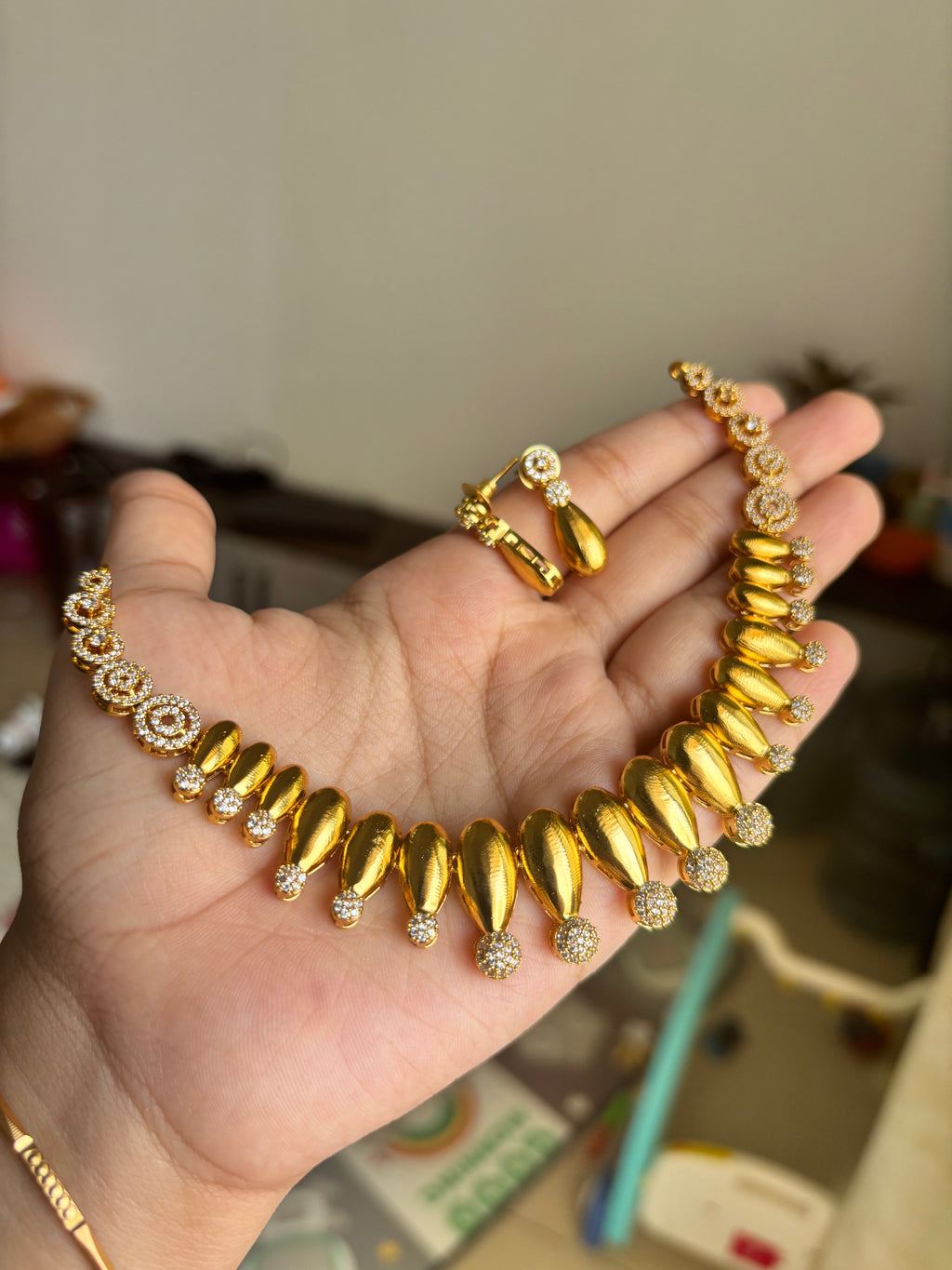 Gold finish diamond set