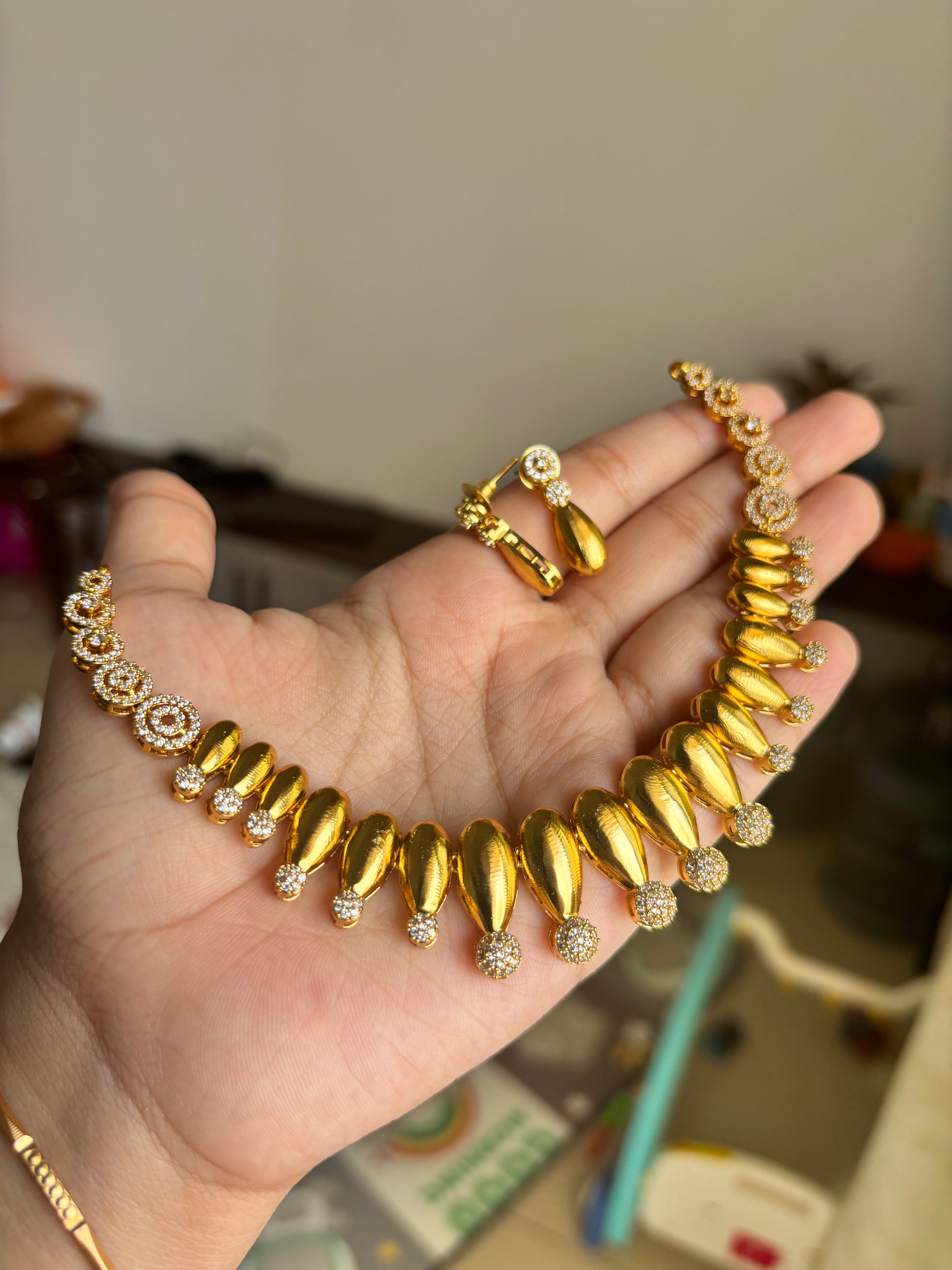 Gold finish diamond set