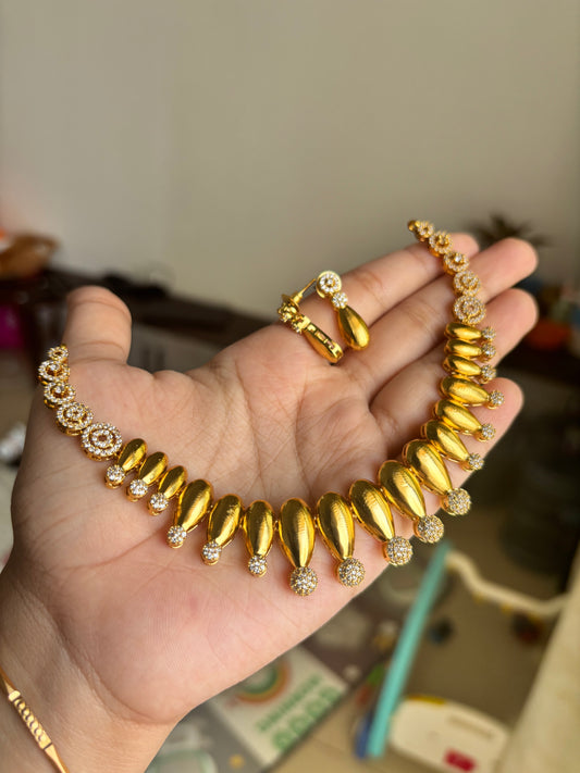 Gold finish diamond set